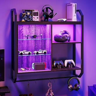 Wall shelf with gaming consoles and accessories, featuring purple LED lights.