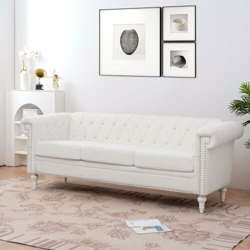 White sofa in a modern living room with art and decor.