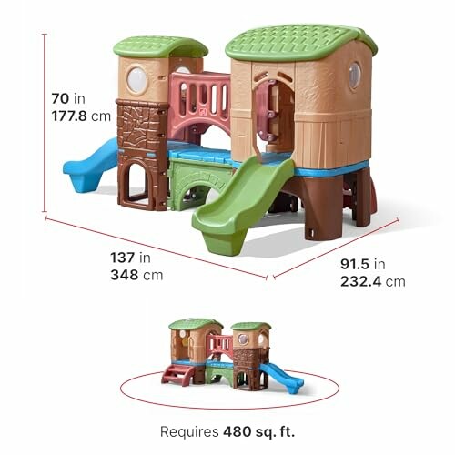 Children's playhouse with slides and climbing features, dimensions labeled.